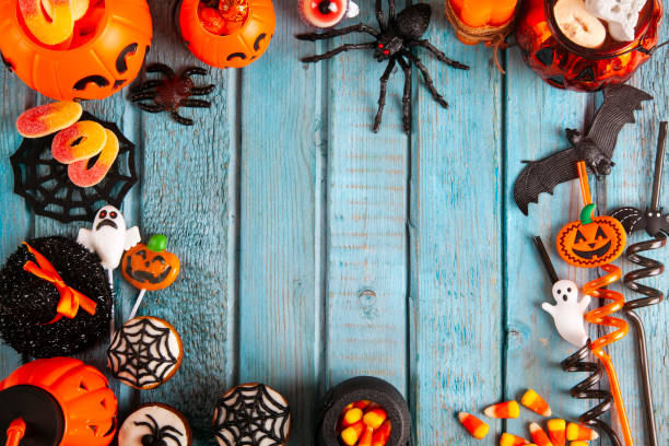 istock Halloween party decorations frame on blue wooden rustic table 1272699225
