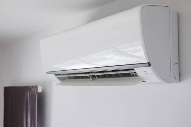 istock Air conditioner on white wall room interior background 1272699455