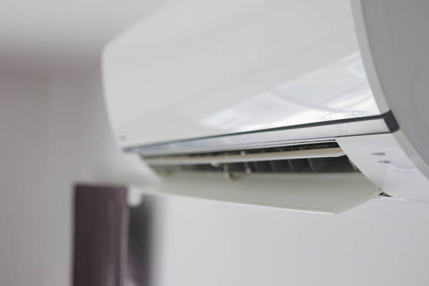 istock Air conditioner on white wall room interior background 1272699456