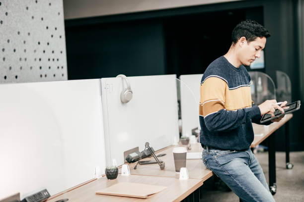 istock Hispanic men in the office working on a business project 1272700396