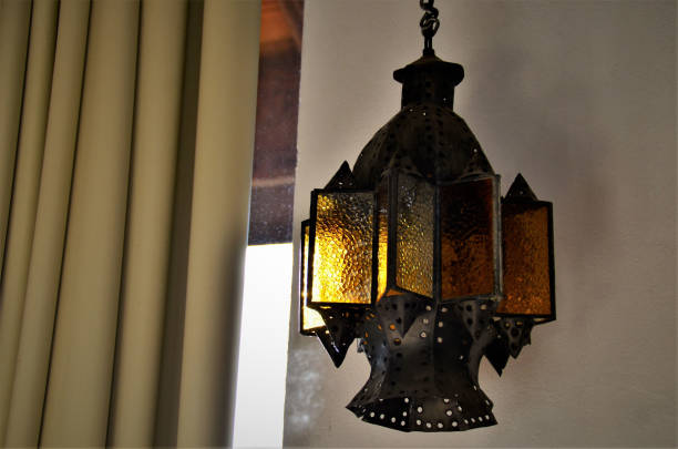 istock A rustic brass chandelier and yellow stained glass 1272702108