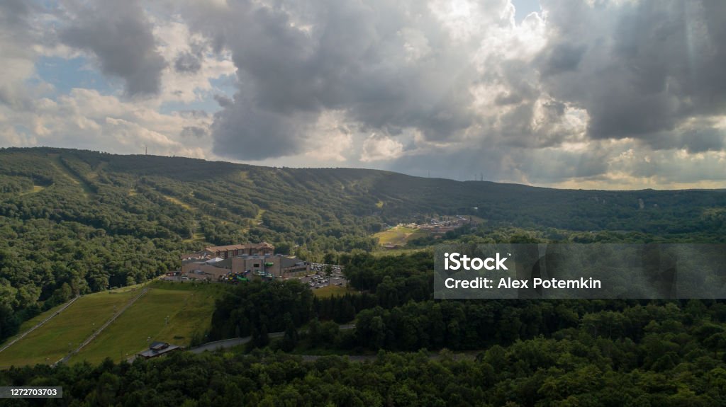 Clouds over mountains. The remote view toward Delaware Water Gap from Sullivan Trail, Poconos, Pennsylvania The remote aerial view on Delaware Water Gap, at the border between Pennsylvania and New Jersey. Ski Resort Stock Photo