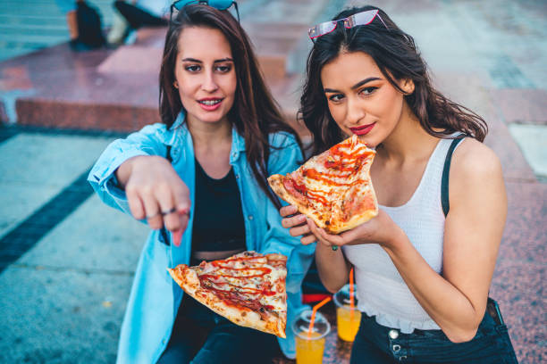 istock Young Woman Showing friends Pointing 1272705284