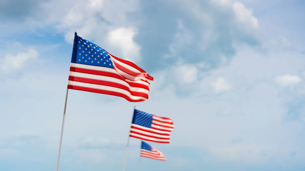 istock American flags against blue sky 1272709300