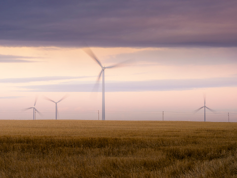 Wind turbines silhouette in sunset, SK, Canada.