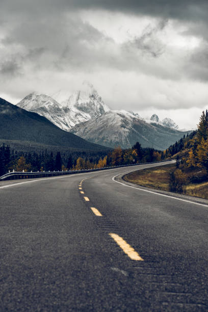 istock winding mountain road in Banff National Park 1272710262