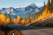 Highway 66 runs through autumn landscape of Kananaskis region in Alberta