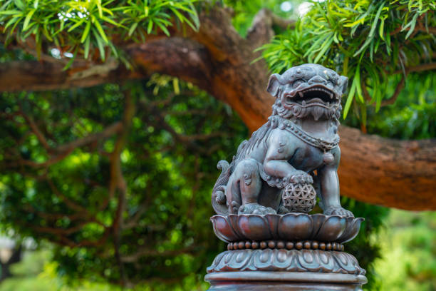 Lion wiht paw on globe in Chi Lin Nunnery Lion wiht paw on globe in Chi Lin Nunnery asian lion stock pictures, royalty-free photos & images