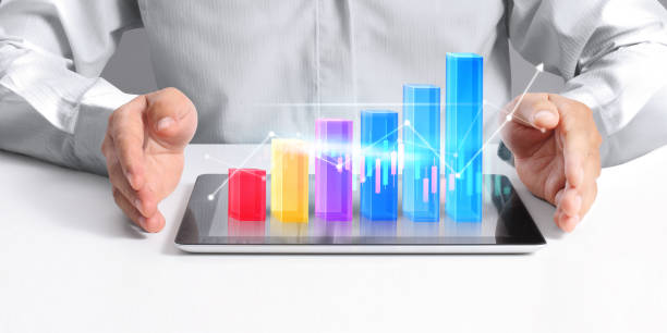 istock Businessman plan graph growth  increase of chart positive indicators in his business, tablet in hand 1272712331