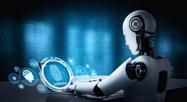 istock Robot humanoid use laptop and sit at table in concept of AI thinking brain 1272712366