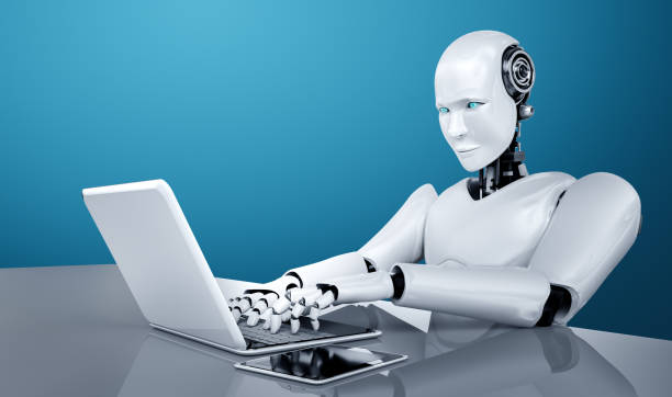 istock Robot humanoid use laptop and sit at table in future office 1272712427