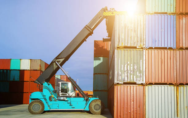 istock Forklift truck working lifting cargo industrial container box at shipping yard for transportation import,export and logistic industrial 1272713185