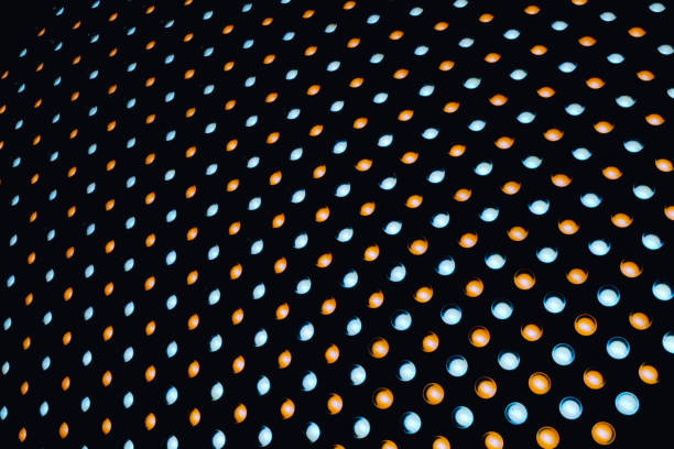 istock Blue and yellow LED stripes on dark background 1272715260