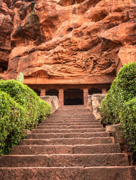 badami cave no one chalukya dynasty ancient stone art from flat angle image is taken at badami karnataka india. it is unesco heritage site and place of amazing chalukya dynasty sotne art.
