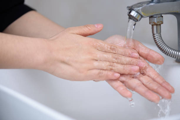 istock Washing hand at sink. 1272717943