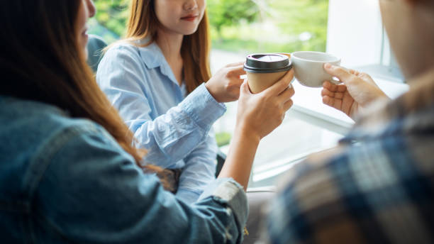istock A group of young people enjoyed drinking and clinking coffee cups 1272718076