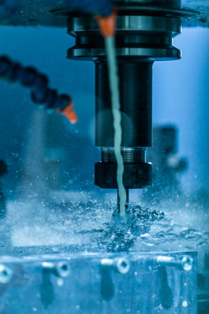 istock A close-up view on swarf wrapped over carbide drill while cnc drilling under liquid coolant. Feed and cutting speed adjusting problem. 1272718970