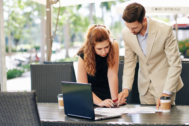istock Business people discussing report 1272720638