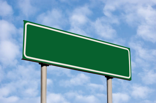 istock Blank Empty Green Destination Road Sign Copy Space Closeup, Bright Cloudscape, Sunny Summer Sky, Clouds 1272720813