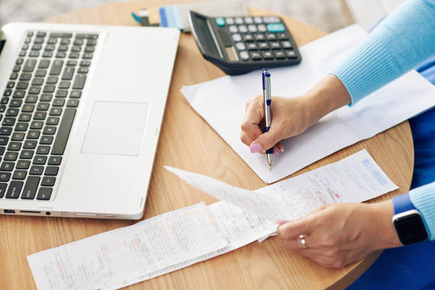 istock Woman calculating expences 1272721101