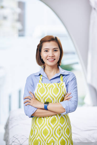 istock Cheerful Asian housewife 1272721144