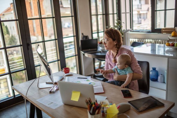 istock Mother with baby working from Home 1272722815