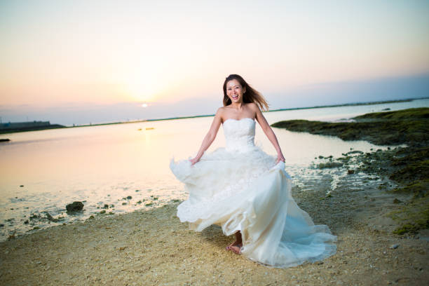 istock Bride on the beach at sunset 1272722844