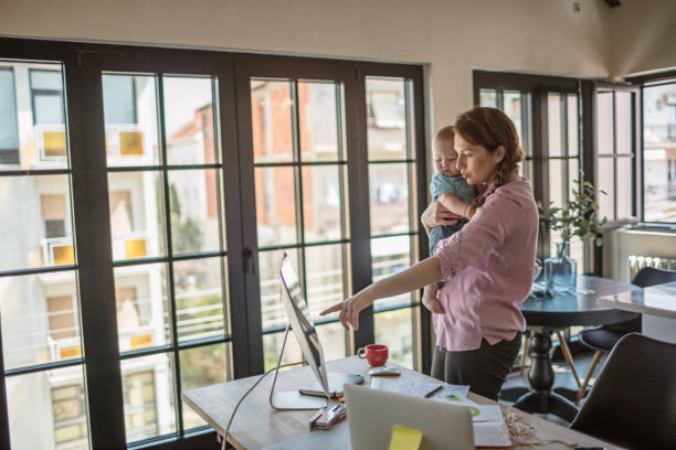 istock Mother with baby working from Home 1272722897
