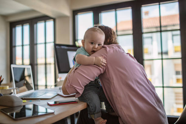 istock Mother with baby working from Home 1272723092