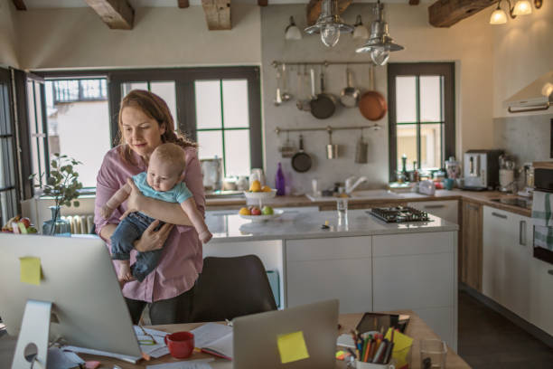 istock Mother with baby working from Home 1272723667