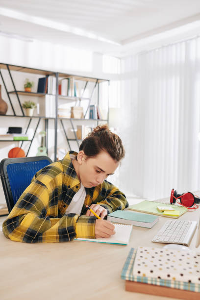 istock Teenage student drawing sketches 1272723681
