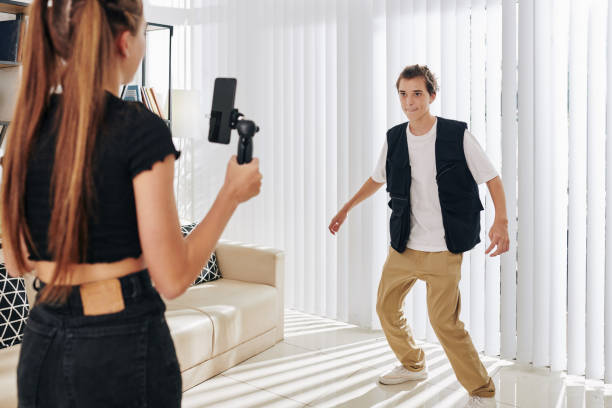 istock Teenagers filming dance video 1272723707