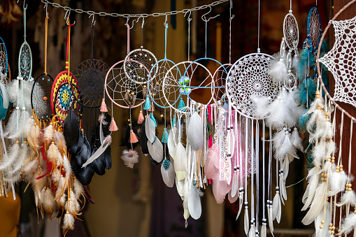 Fluffy variety of dream catchers on artisan street market of an old city Hoi An, Vietnam. Colorful dreamcatchers, close up