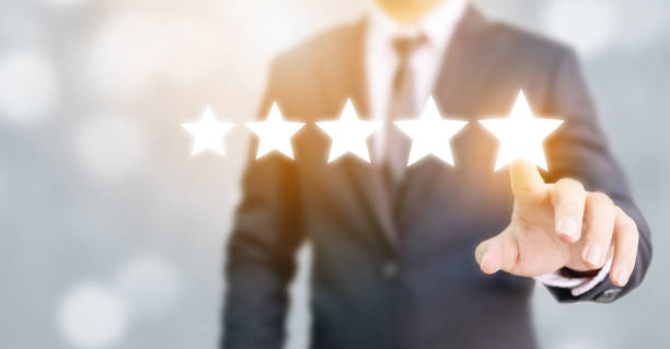 Hand of businessman touching five star symbol to increase rating of company concept Hand of businessman touching five star symbol to increase rating of company concept customer focused stock pictures, royalty-free photos & images