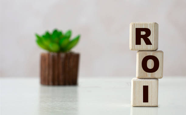 istock ROI word on wooden cubes on a light background with a cactus 1272726365