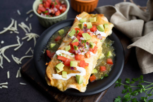 istock Honey lime chicken enchiladas with toppings 1272727541