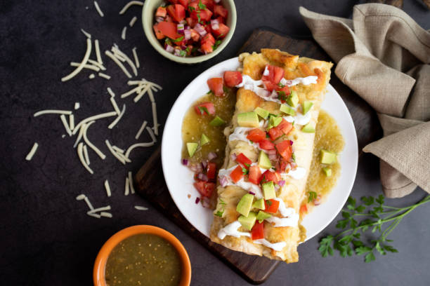 istock Honey lime chicken enchiladas with toppings 1272727552