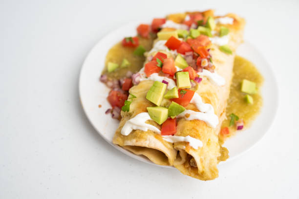 istock Honey lime chicken enchiladas with toppings 1272727563
