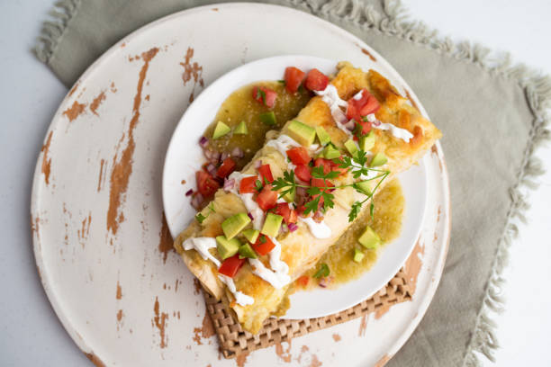 istock Honey lime chicken enchiladas with toppings 1272727585