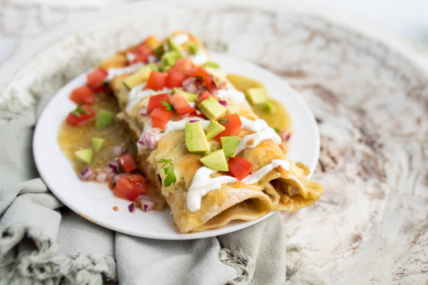 istock Honey lime chicken enchiladas with toppings 1272728129