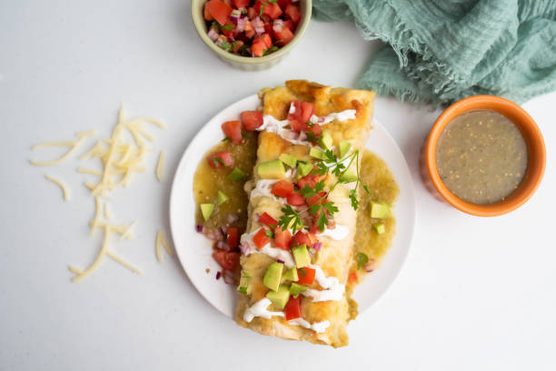 istock Honey lime chicken enchiladas with toppings 1272728200