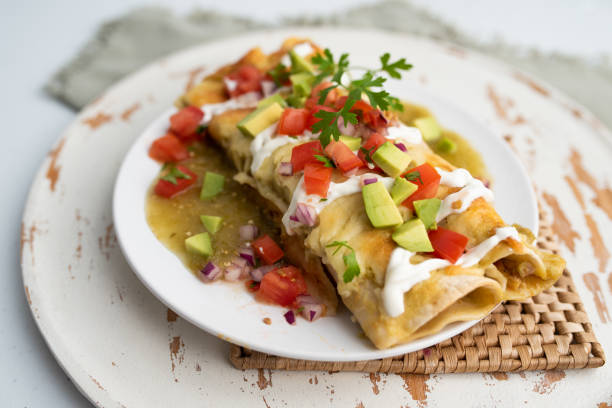 istock Honey lime chicken enchiladas with toppings 1272728277