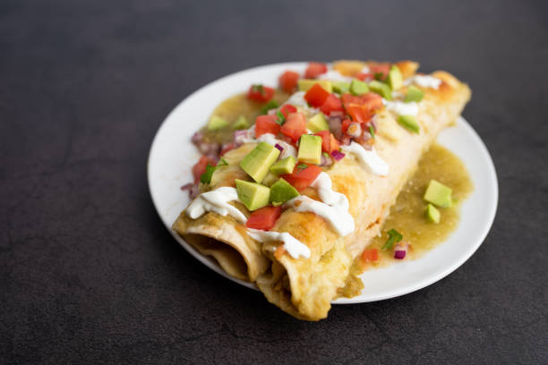 istock Honey lime chicken enchiladas with toppings 1272728338