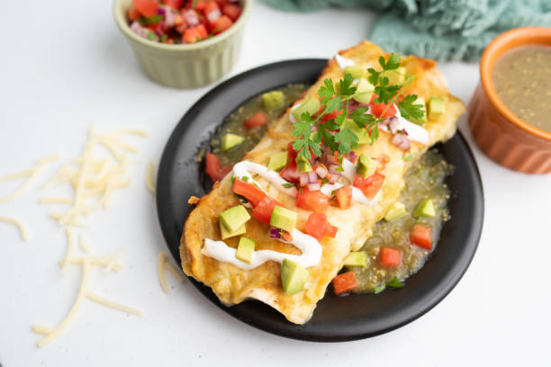 istock Honey lime chicken enchiladas with toppings 1272728447