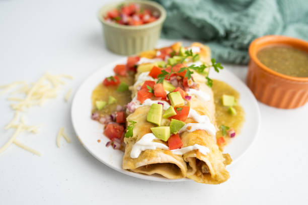 istock Honey lime chicken enchiladas with toppings 1272728456