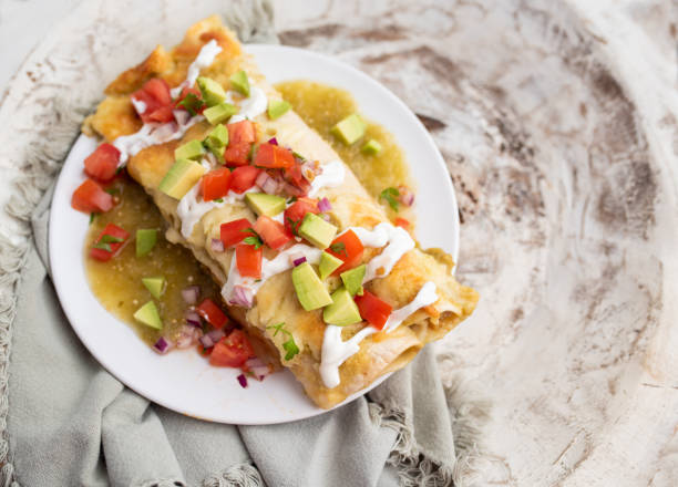 istock Honey lime chicken enchiladas with toppings 1272728574