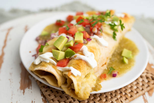 istock Honey lime chicken enchiladas with toppings 1272728628