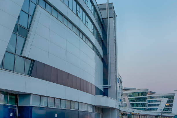 istock Line of Modern Building Facade Against Blue Sky At Blue Hour. Horizontal Image Composition 1272730968