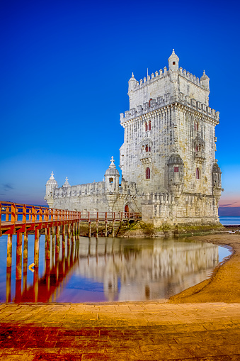 Ancient Belem Tower on Tagus River in Lisbon at Blue Hour in Portugal. Vertical Image