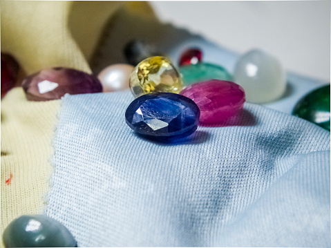 Close up macro photograph of blue sapphire gem stone.